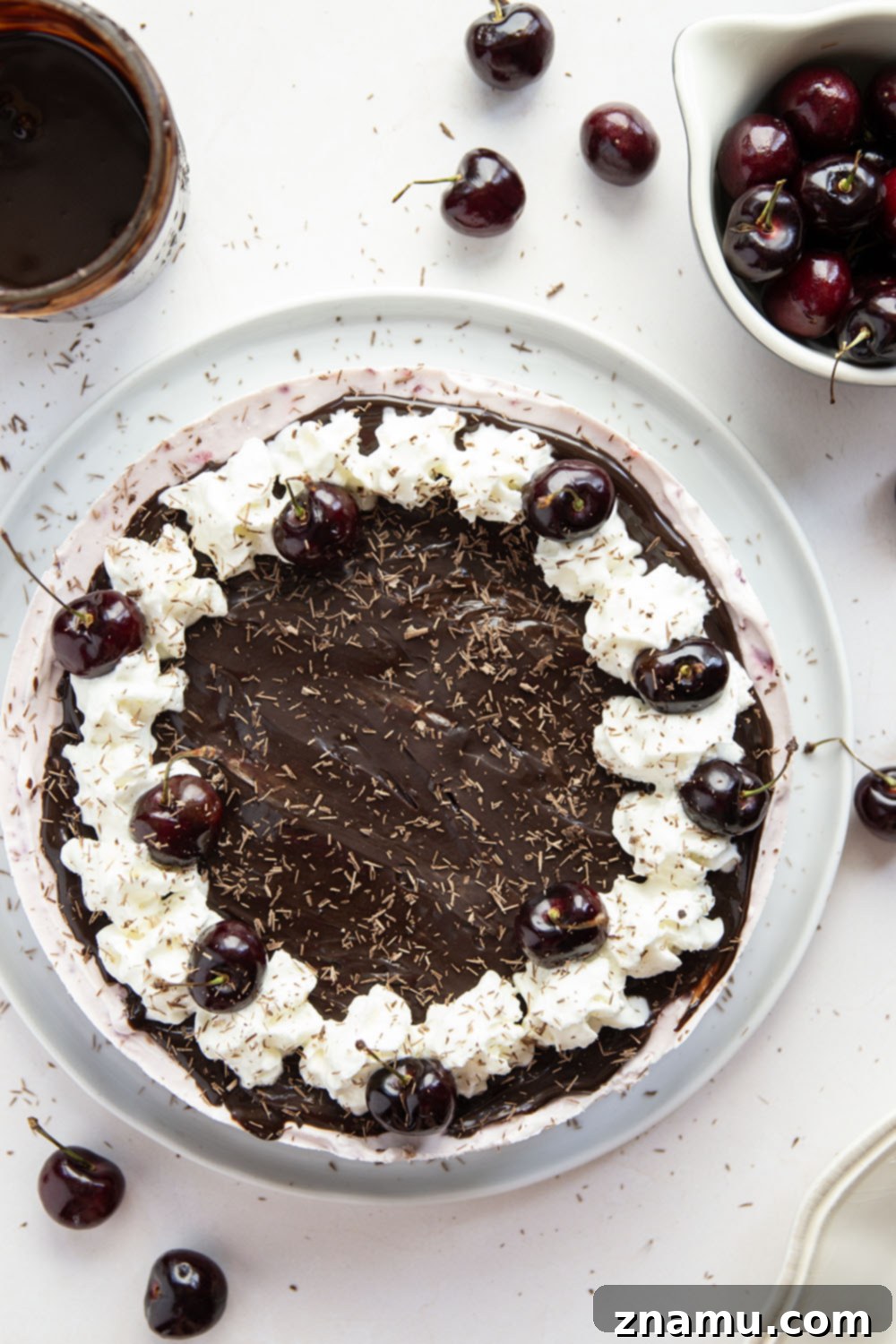 Black Forest Frozen Cheesecake 4 This frozen black forest cheesecake is completely no-bake and features a buttery Oreo crust, silky cherry cheesecake filling, and lots of hot fudge sauce on top.