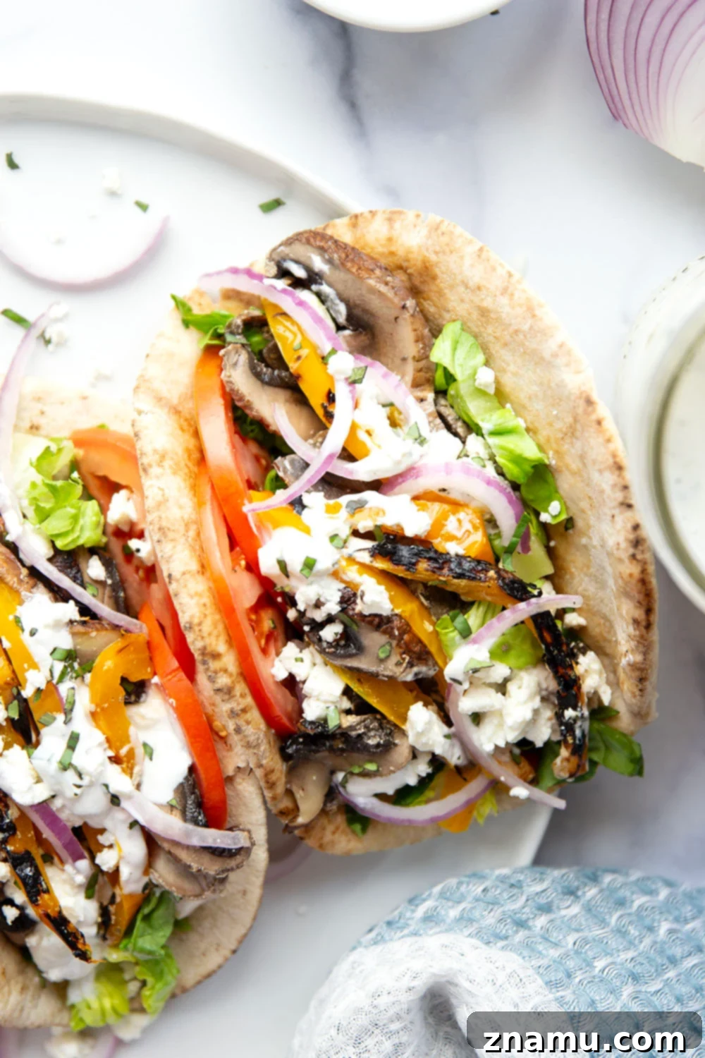 Savory Grilled Portobello Gyros 2 These portobello mushroom gyros feature tender portobello mushrooms and sweet peppers marinated in a flavorful yogurt marinade, grilled to perfection, and stuffed in a soft pita with all the classic gyro ingredients.