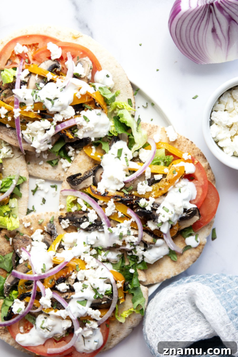 Savory Grilled Portobello Gyros 5 These portobello mushroom gyros feature tender portobello mushrooms and sweet peppers marinated in a flavorful yogurt marinade, grilled to perfection, and stuffed in a soft pita with all the classic gyro ingredients.