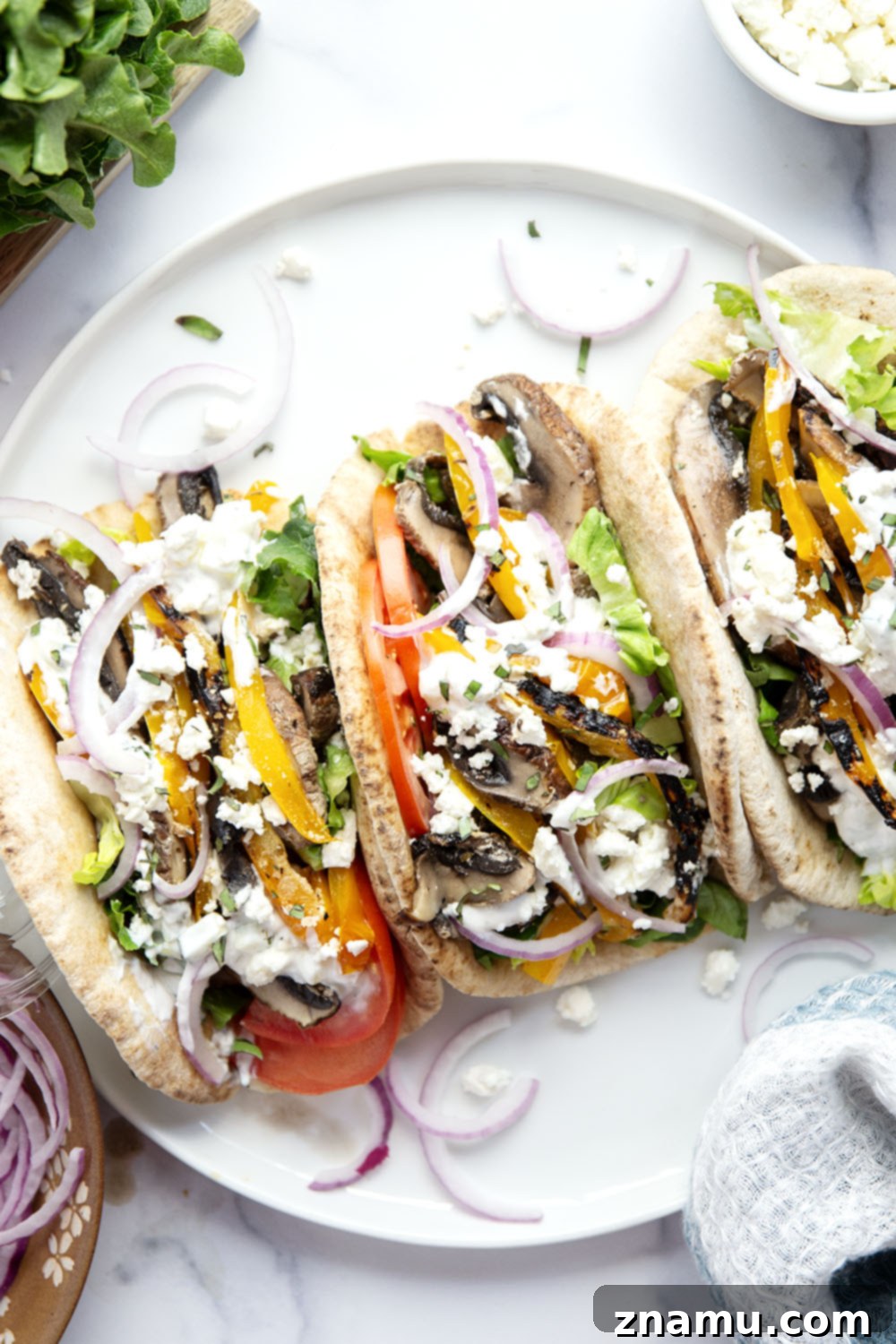 Savory Grilled Portobello Gyros 6 These portobello mushroom gyros feature tender portobello mushrooms and sweet peppers marinated in a flavorful yogurt marinade, grilled to perfection, and stuffed in a soft pita with all the classic gyro ingredients.