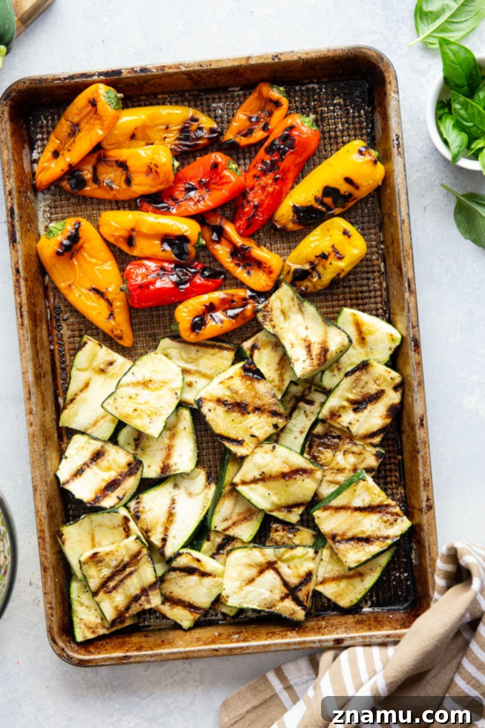 Smoky Grilled Vegetables, Creamy Burrata, Zesty Chimichurri 4 Arrangement of grilled zucchini, sweet peppers, and burrata on a platter, drizzled with vibrant chimichurri.