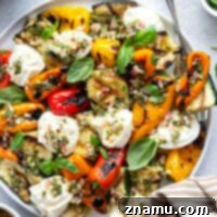 Smoky Grilled Vegetables, Creamy Burrata, Zesty Chimichurri 8 Grilled to perfection and served with creamy burrata and a fresh chimichurri sauce, this grilled zucchini and peppers is an easy summer side dish that's ready in minutes.