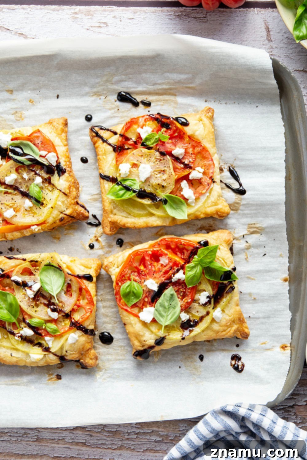 Jewel-Toned Heirloom Tomato Tarts with Tangy Goat Cheese 4 Flaky puff pastry is baked with a sweet heirloom tomato filling and lots of flavorful goat cheese in these easy heirloom tomato tarts!