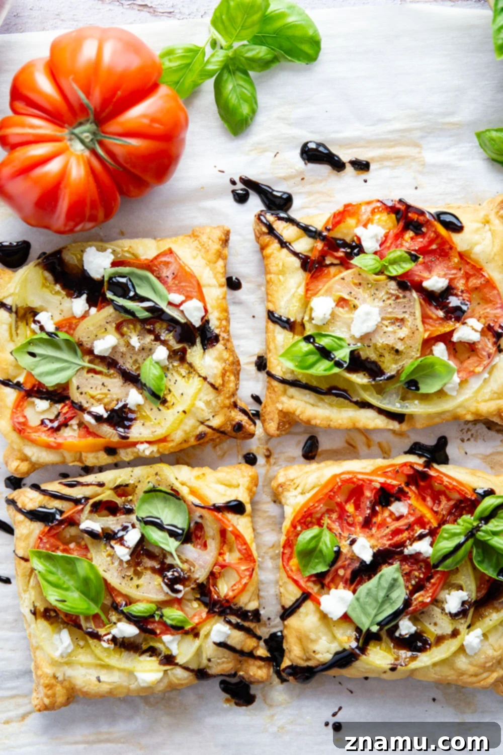 Jewel-Toned Heirloom Tomato Tarts with Tangy Goat Cheese 5 Flaky puff pastry is baked with a sweet heirloom tomato filling and lots of flavorful goat cheese in these easy heirloom tomato tarts!