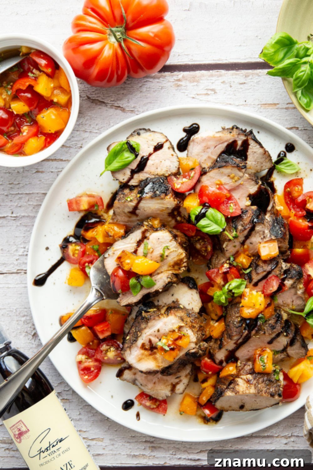 Grilled Pork Loin with Zesty Bruschetta 2 Juicy Grilled Bruschetta Pork Loin, balsamic marinated and topped with fresh basil and tomato