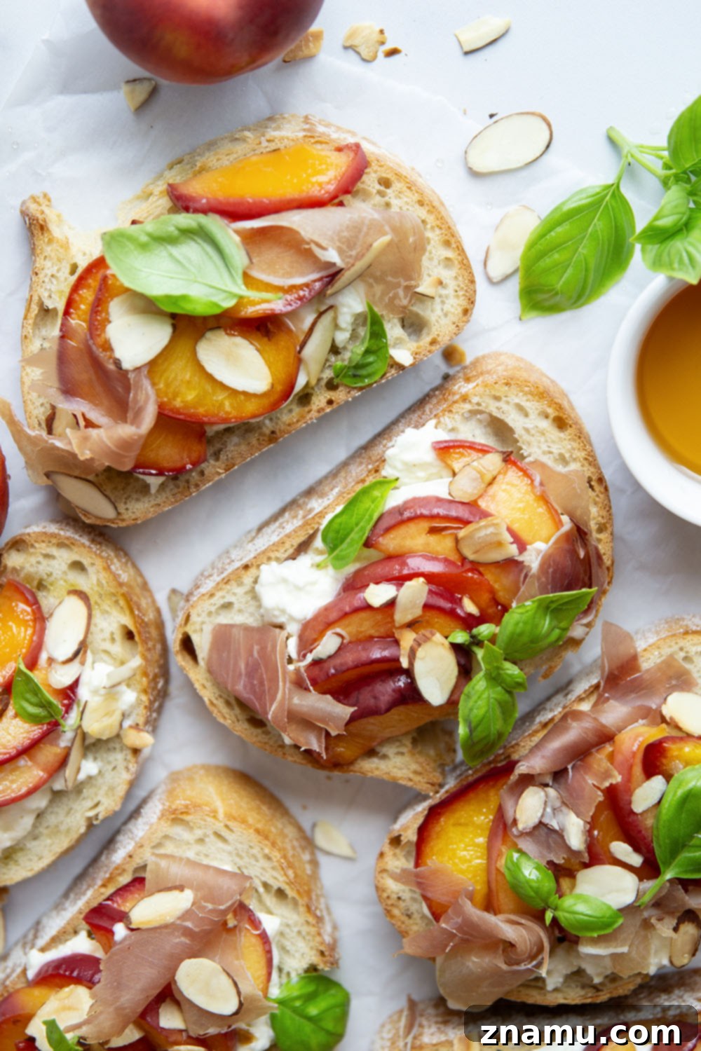 Burrata Toast with Honey Roasted Peaches 5 A serving of Honey Roasted Peach Burrata Toast on a rustic wooden board.