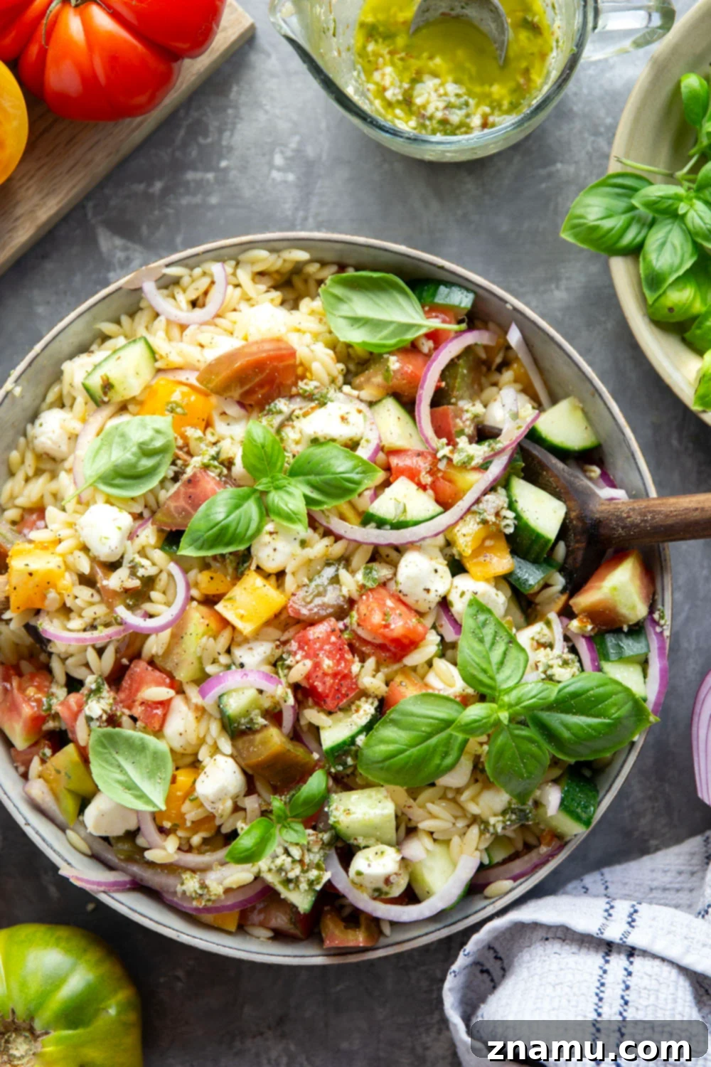 Heirloom Tomato & Orzo Medley with Zesty Pesto Vinaigrette 5 Loaded with summery heirloom tomatoes and a flavorful pesto vinaigrette, this heirloom tomato orzo salad comes together in a snap and is loaded with fresh ingredients!