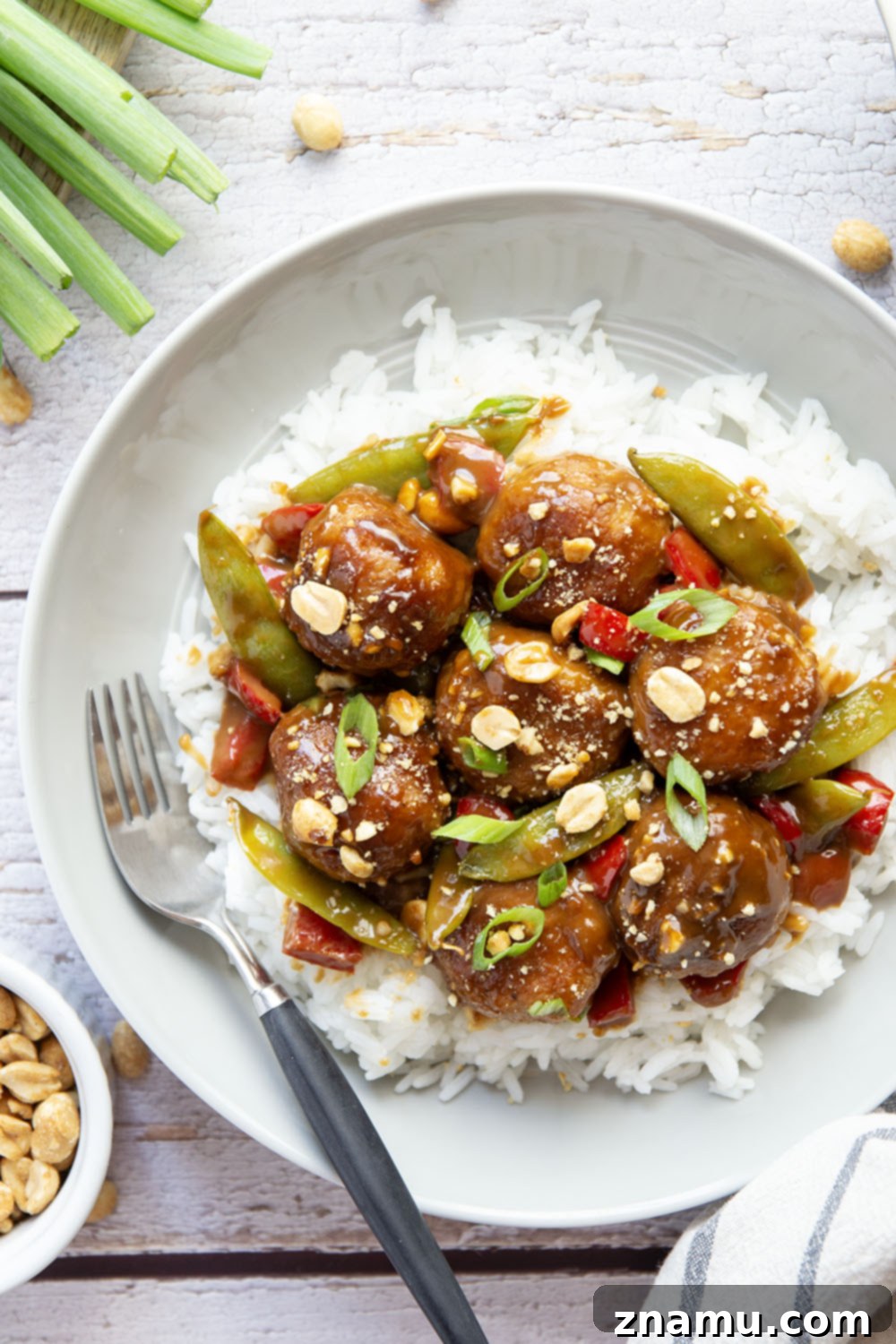 Nutty Satay Chicken Bites 6 Serving of Peanut Chicken Satay Meatballs with rice and garnishes