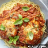 Homemade fire roasted tomatoes serve as the base to this flavorful fire roasted tomato chicken that features tender chicken breasts simmered in a creamy scratch-made tomato sauce with lots of fresh basil.