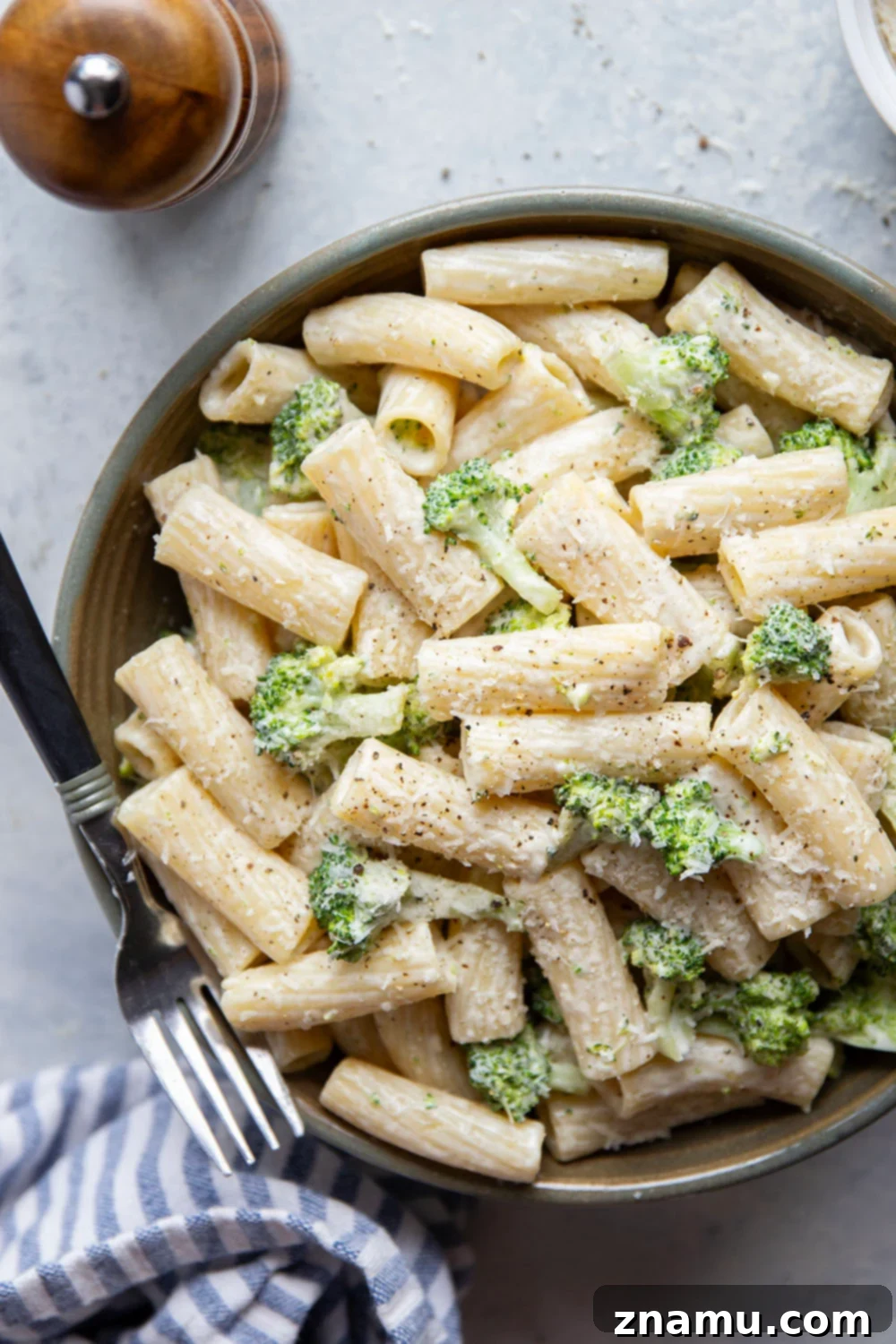 Velvety Parmesan Broccoli Pasta 5 A bowl of creamy Parmesan broccoli pasta with fresh basil