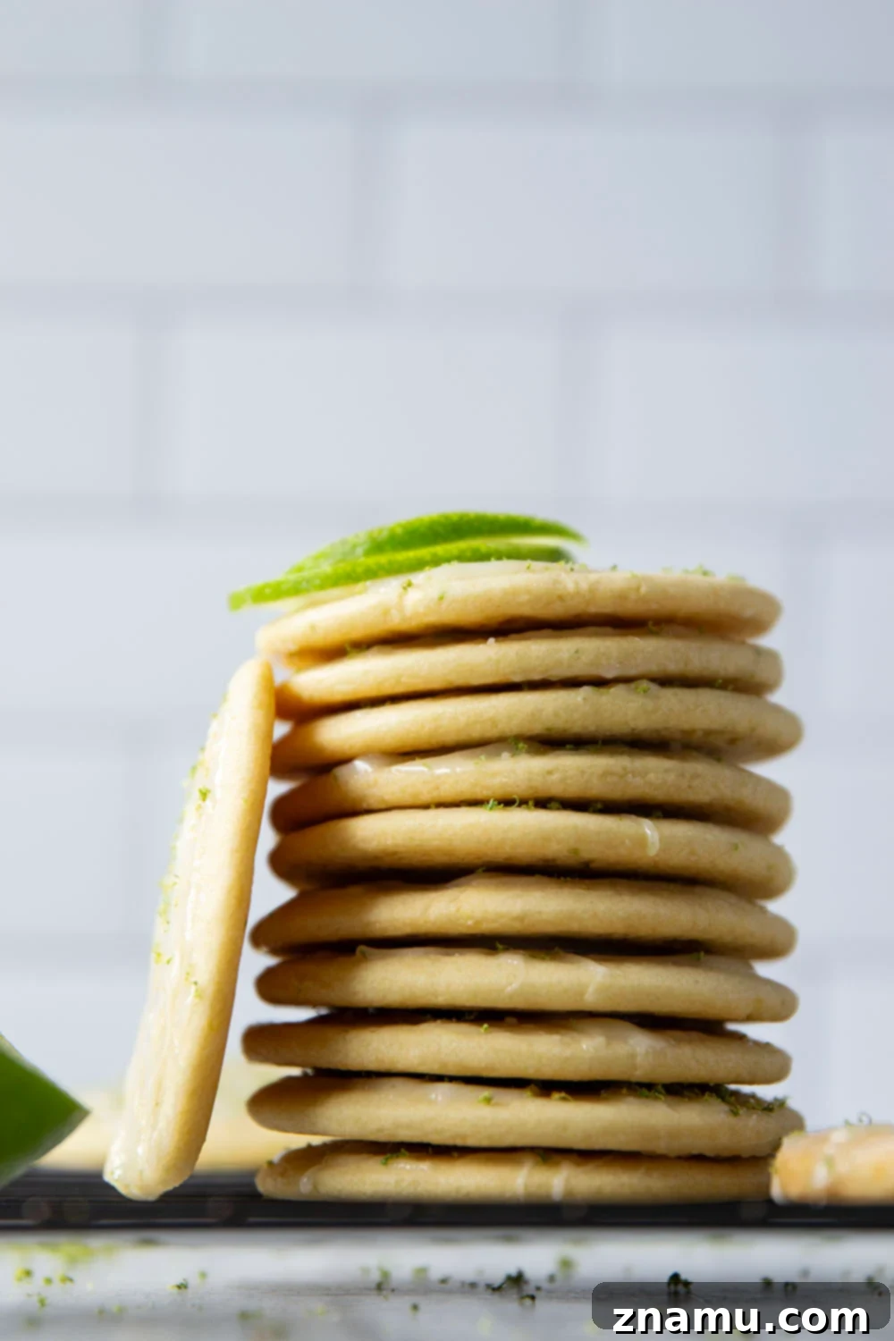 Zesty Lime Cream Cheese Tea Cakes 4 Freshly baked round tea cakes cooling on a wire rack before glazing