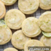 Soft, cake-like tea cakes are topped with a rich lime cream cheese glaze for the best little dessert or snack bite!