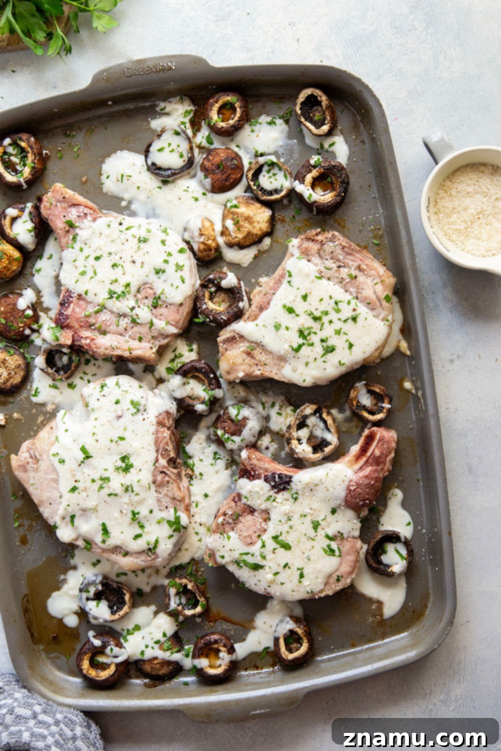 Close-up of Sheet Pan Garlic Parmesan Pork Chops with Golden Mushrooms and Rich Cream Sauce