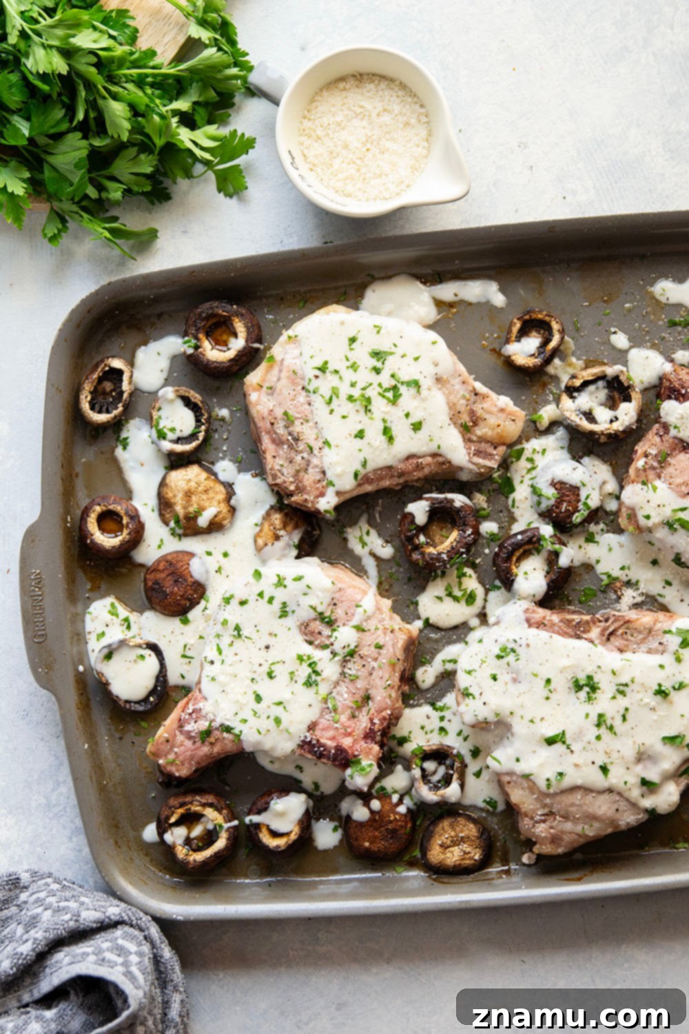Preparing Garlic Parmesan Pork Chops and Mushrooms on a Sheet Pan for Roasting