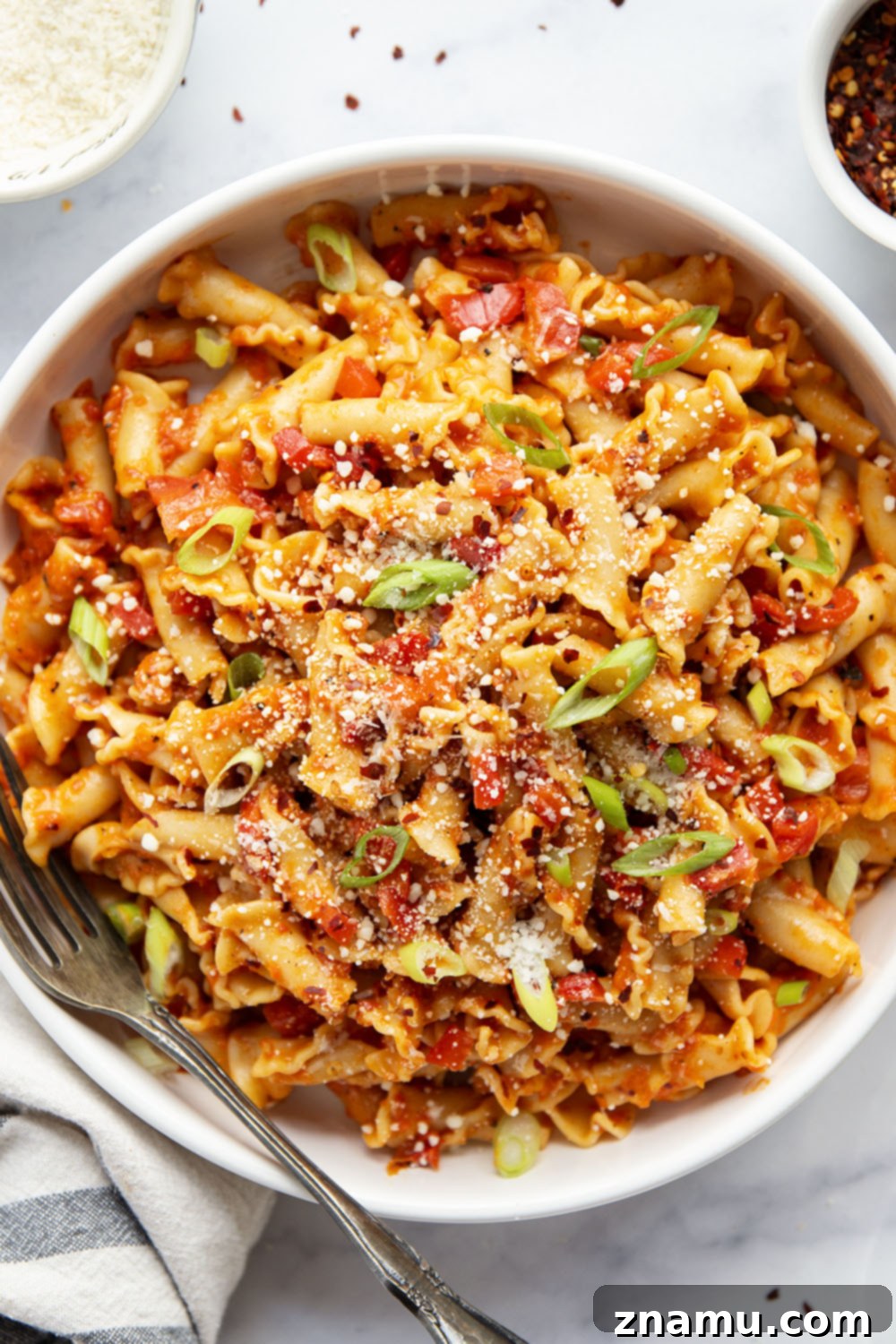 Fiery Roasted Red Pepper Pasta 4 Overhead view of a bowl of roasted red pepper pasta.