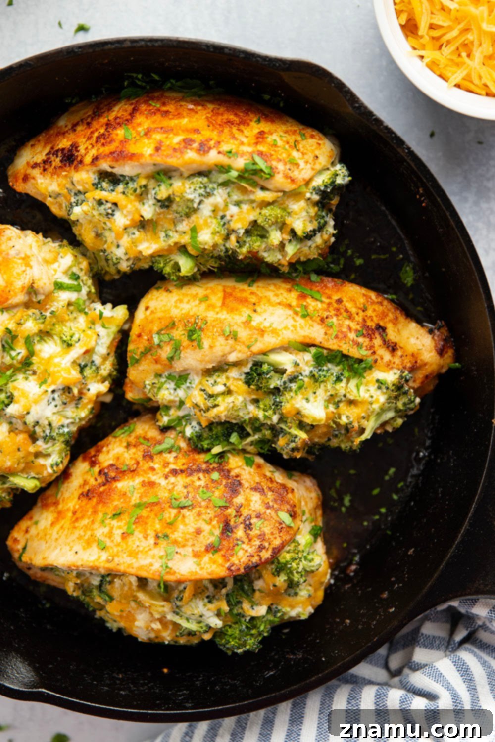 Broccoli and Cheese-Filled Chicken Breast 2 Juicy chicken breasts stuffed with a creamy broccoli cheddar filling and baked to golden perfection, a quick and easy dinner recipe.