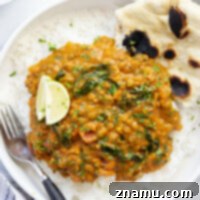 This pumpkin lentil curry features tender lentils simmered in an super flavorful pumpkin curry sauce and piled high over bowls of fluffy rice with fresh cilantro and lime wedges.