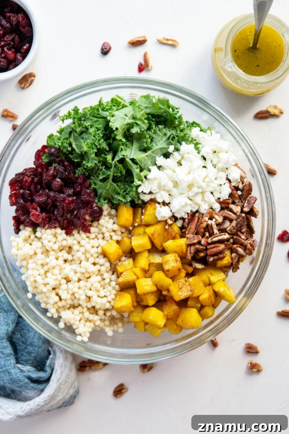 Vibrant Roasted Butternut Squash Couscous Salad 2 This butternut squash couscous salad features spice-roasted butternut squash, tender pearl couscous, and lots of fall ingredients all tossed in a honey Dijon dressing.