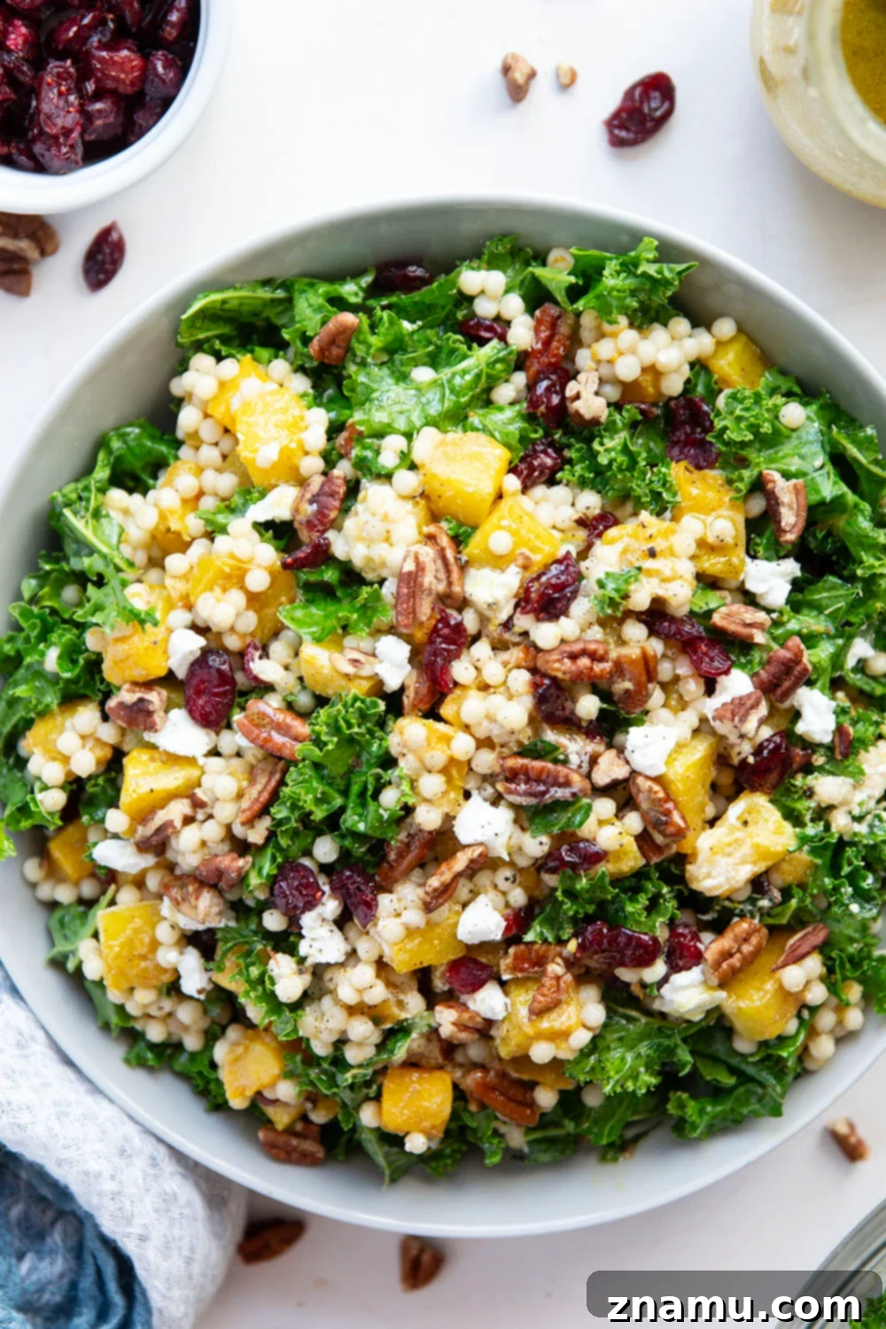 Vibrant Roasted Butternut Squash Couscous Salad 5 This butternut squash couscous salad features spice-roasted butternut squash, tender pearl couscous, and lots of fall ingredients all tossed in a honey Dijon dressing.