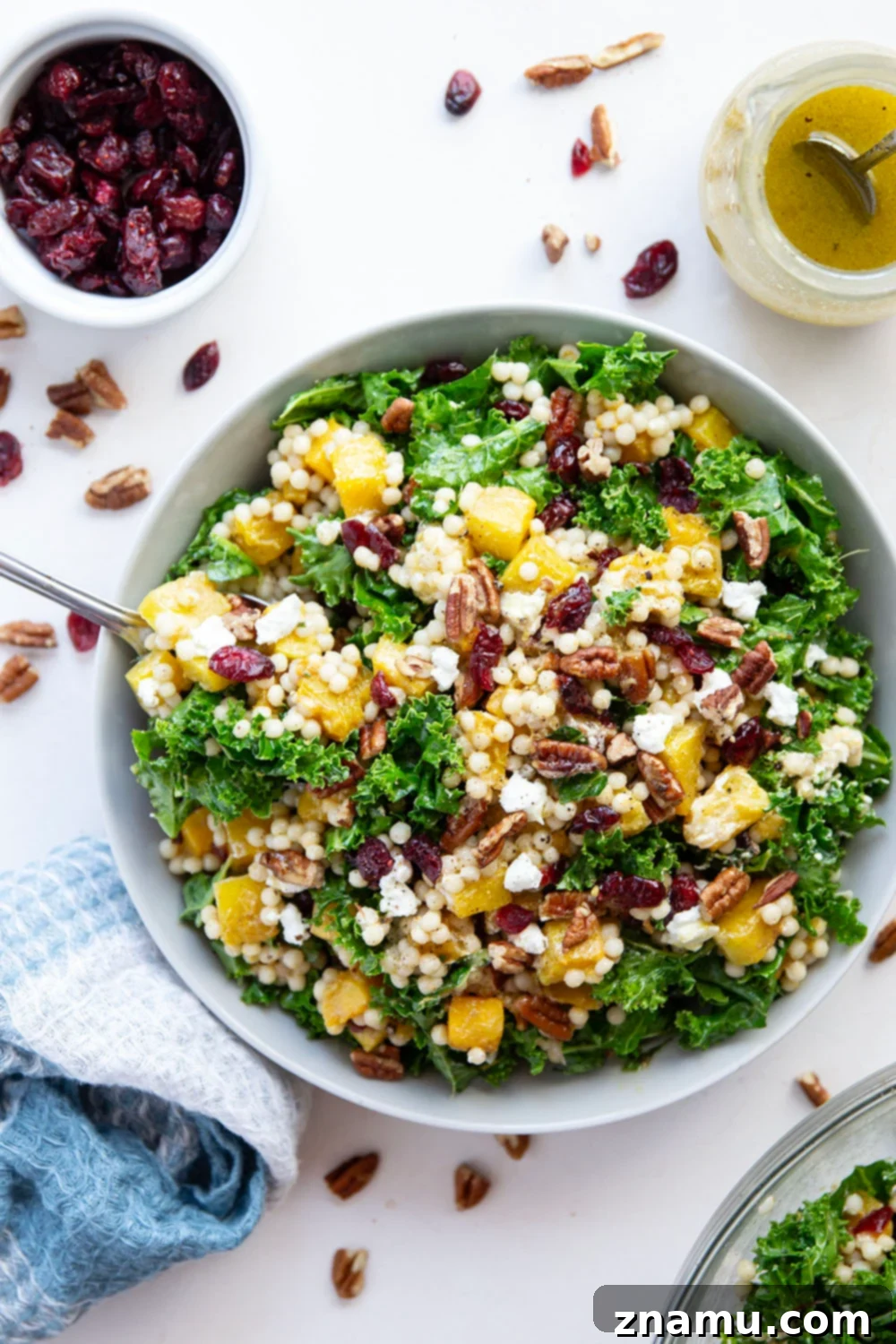 Vibrant Roasted Butternut Squash Couscous Salad 6 This butternut squash couscous salad features spice-roasted butternut squash, tender pearl couscous, and lots of fall ingredients all tossed in a honey Dijon dressing.