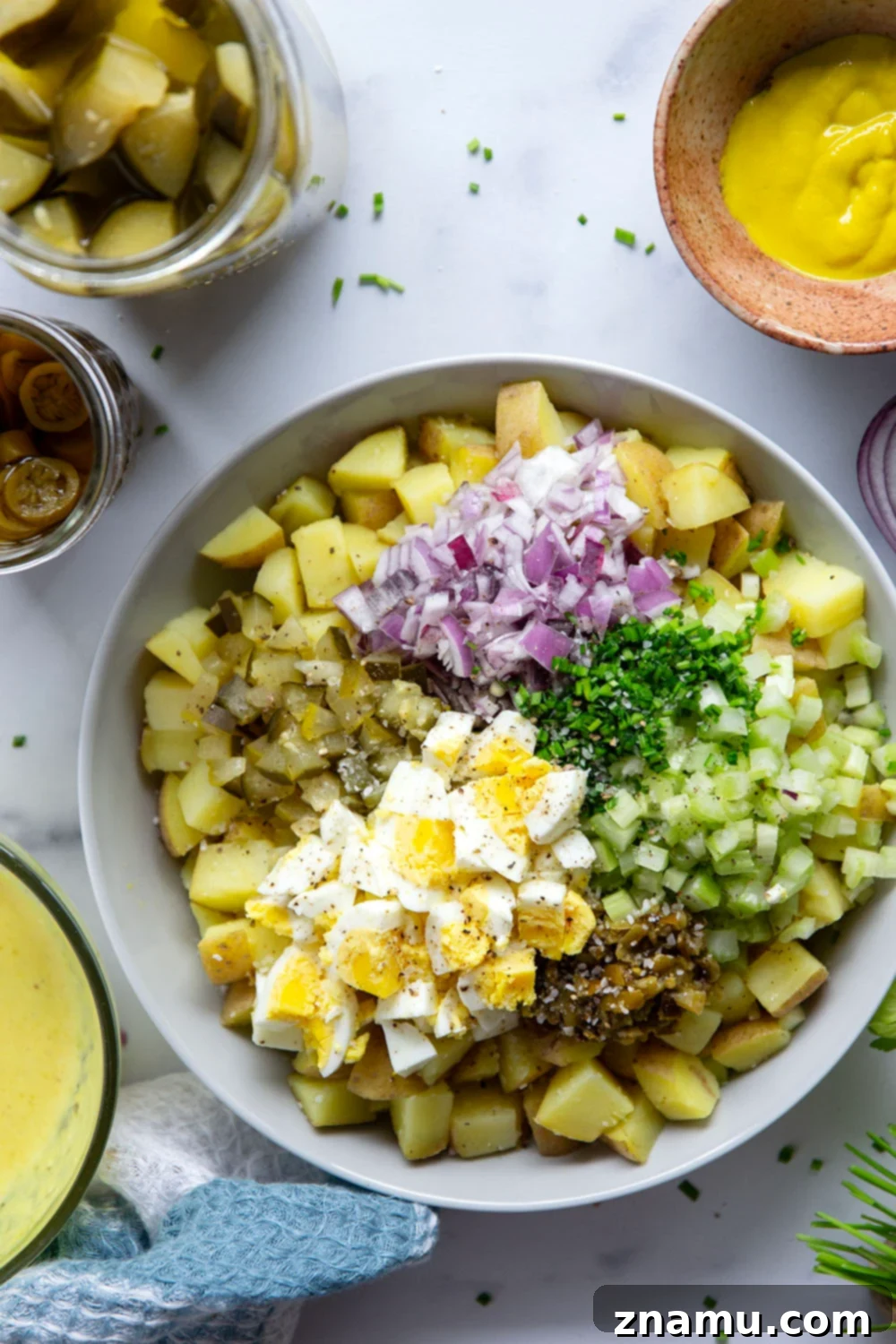 Authentic Texas Potato Salad 3 Texas potato salad features a tangy yellow mustard dressing coating tender potatoes with lots of pickled jalapenos for a kick of heat.