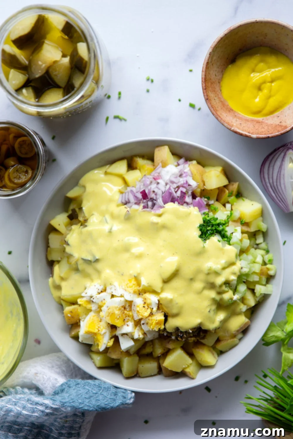 Authentic Texas Potato Salad 4 Texas potato salad features a tangy yellow mustard dressing coating tender potatoes with lots of pickled jalapenos for a kick of heat.