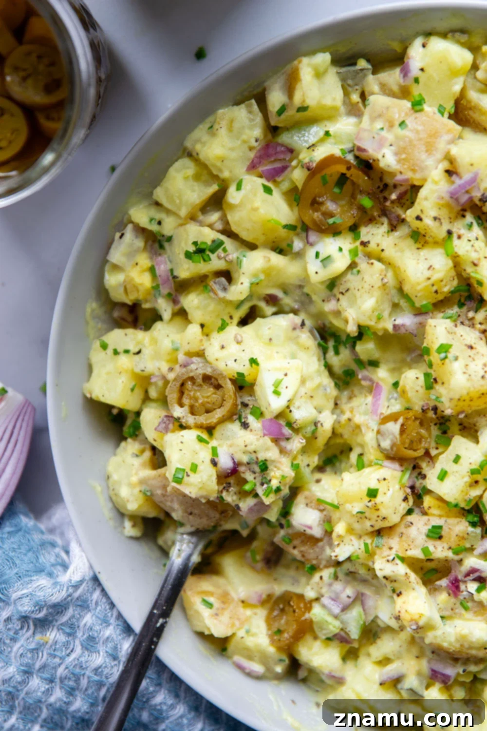 Authentic Texas Potato Salad 5 Texas potato salad features a tangy yellow mustard dressing coating tender potatoes with lots of pickled jalapenos for a kick of heat.