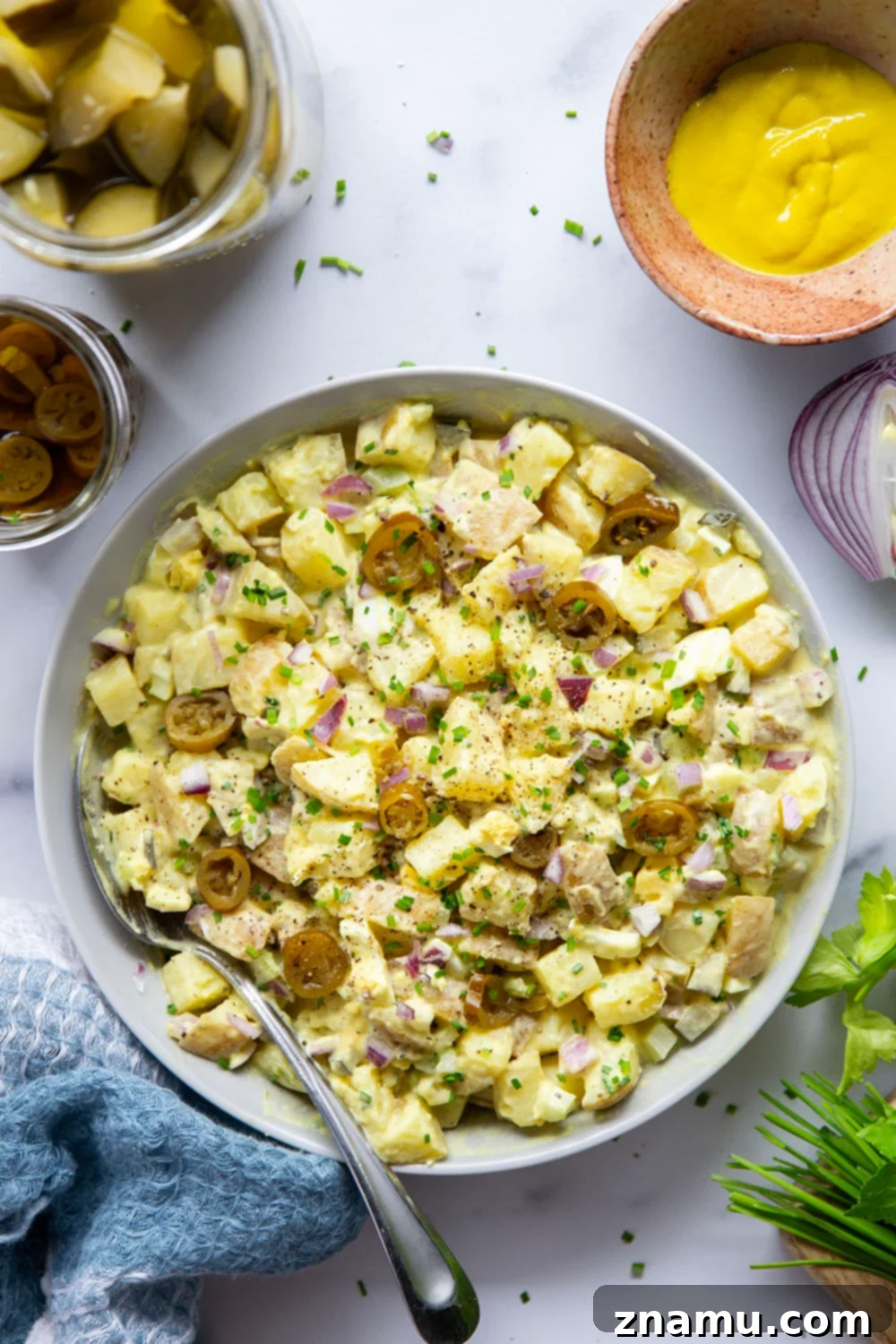Authentic Texas Potato Salad 6 Texas potato salad features a tangy yellow mustard dressing coating tender potatoes with lots of pickled jalapenos for a kick of heat.