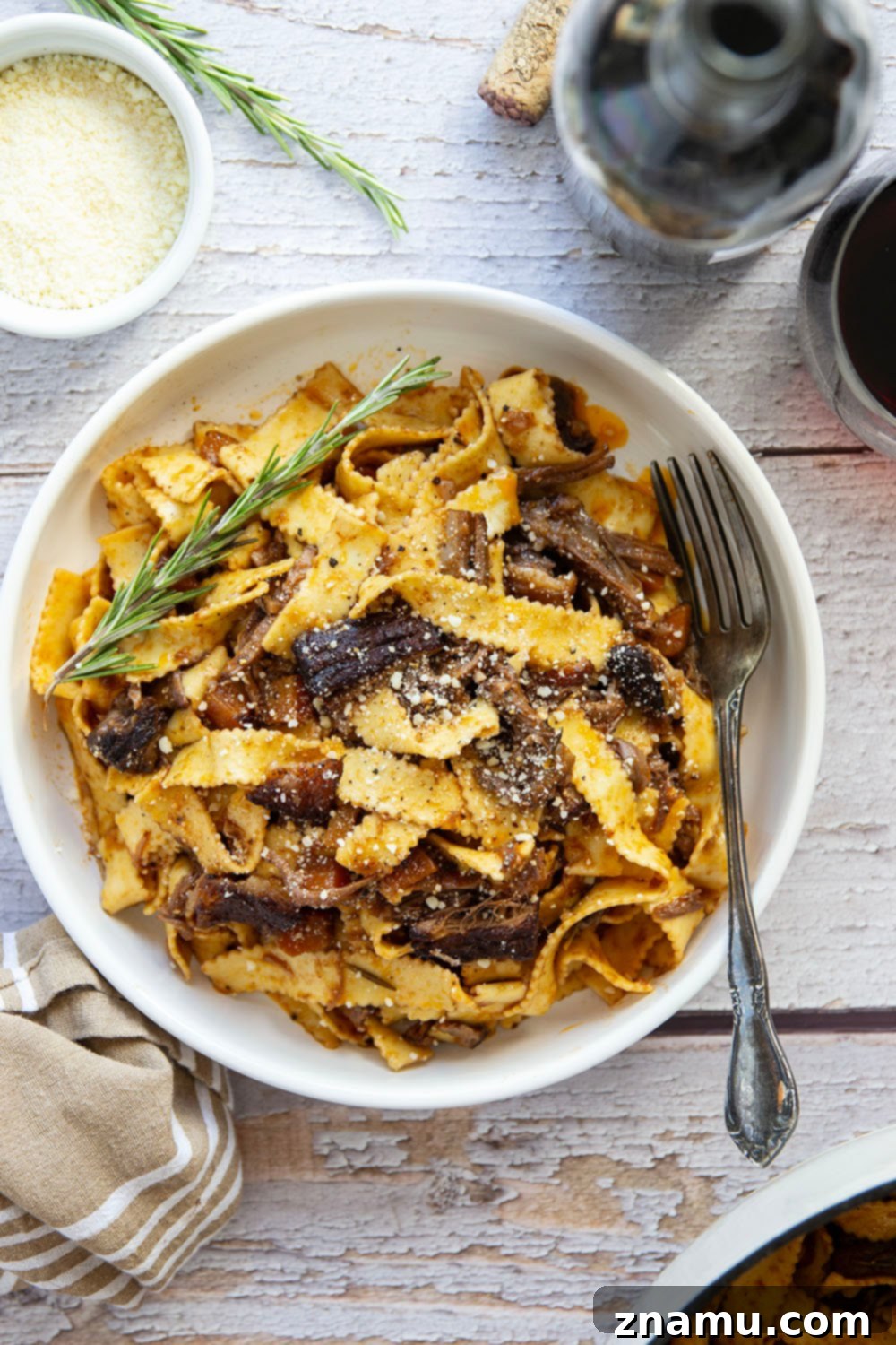 Braised for hours in flavorful red wine and lots of aromatics, this red wine beef short rib ragu features tender pappardelle noodles folded into a fall-apart tender short rib red wine sauce.