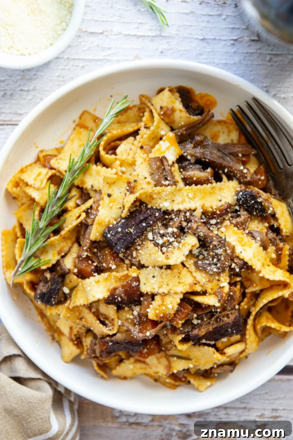 Braised for hours in flavorful red wine and lots of aromatics, this red wine beef short rib ragu features tender pappardelle noodles folded into a fall-apart tender short rib red wine sauce.