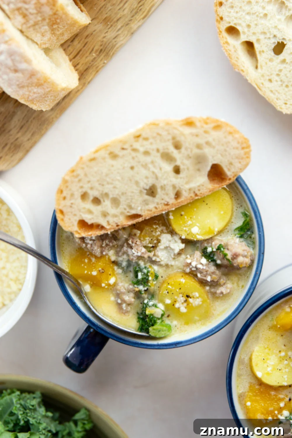 Soft butternut squash cubes change up classic zuppa toscana into a fall comfort food favorite! This butternut squash zuppa toscana comes together in minutes and is amazing with rustic bread for dipping.