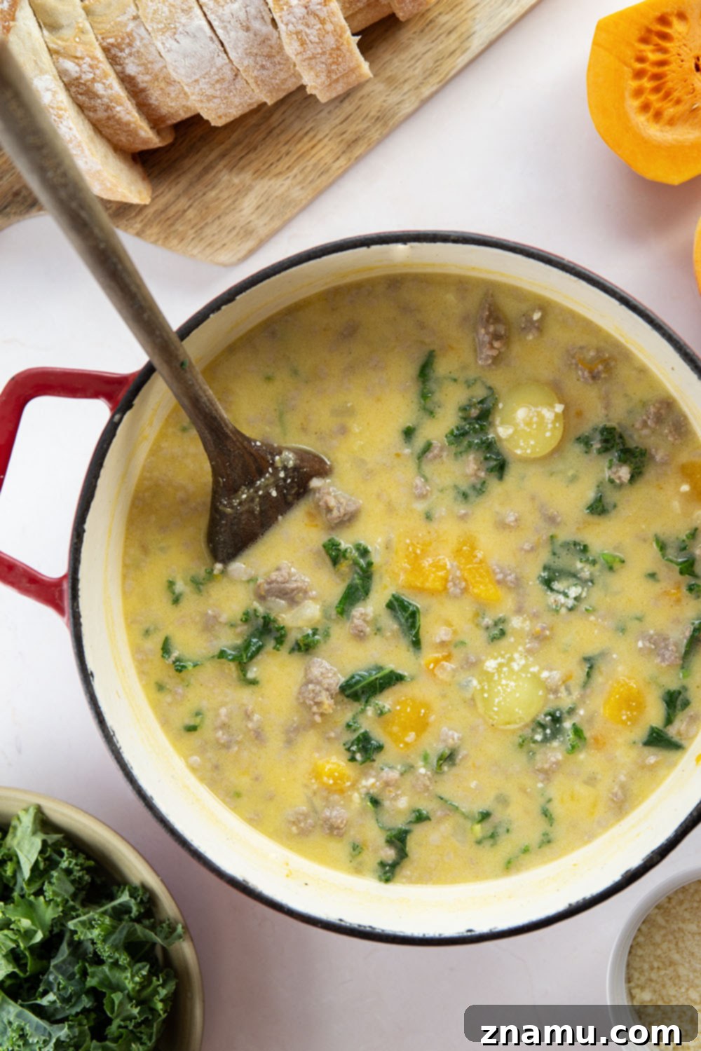 Soft butternut squash cubes change up classic zuppa toscana into a fall comfort food favorite! This butternut squash zuppa toscana comes together in minutes and is amazing with rustic bread for dipping.