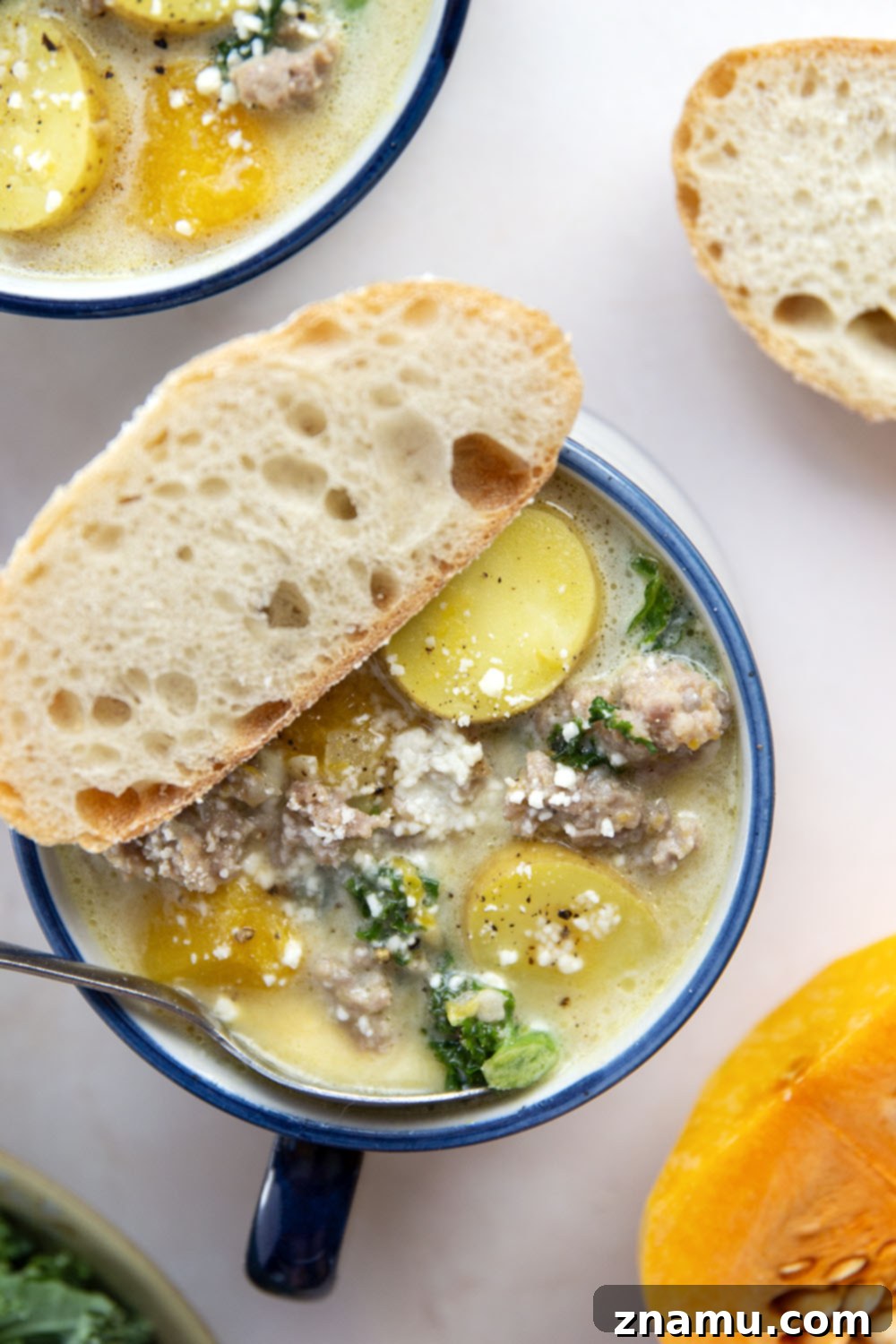 Soft butternut squash cubes change up classic zuppa toscana into a fall comfort food favorite! This butternut squash zuppa toscana comes together in minutes and is amazing with rustic bread for dipping.