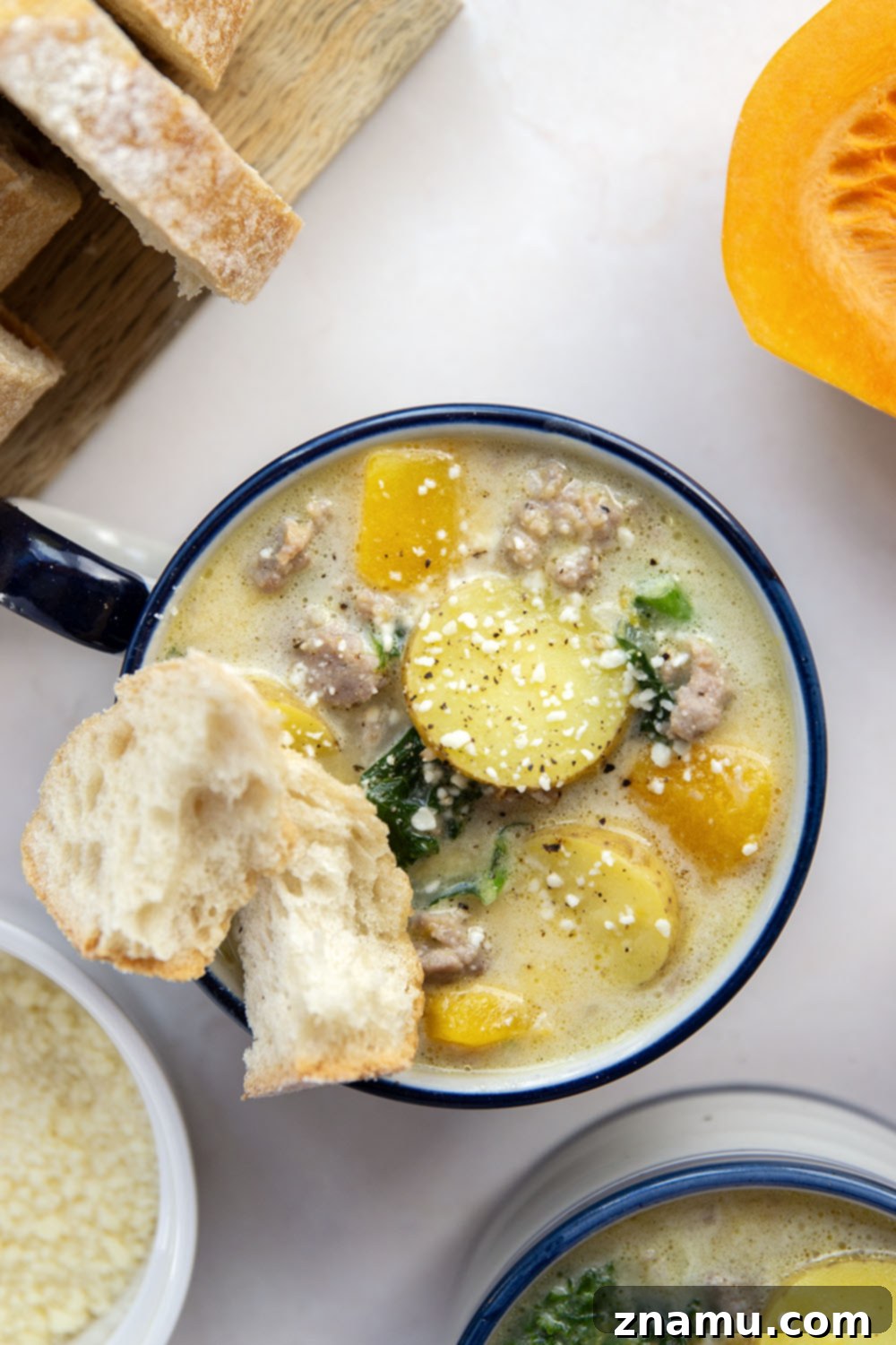 Soft butternut squash cubes change up classic zuppa toscana into a fall comfort food favorite! This butternut squash zuppa toscana comes together in minutes and is amazing with rustic bread for dipping.