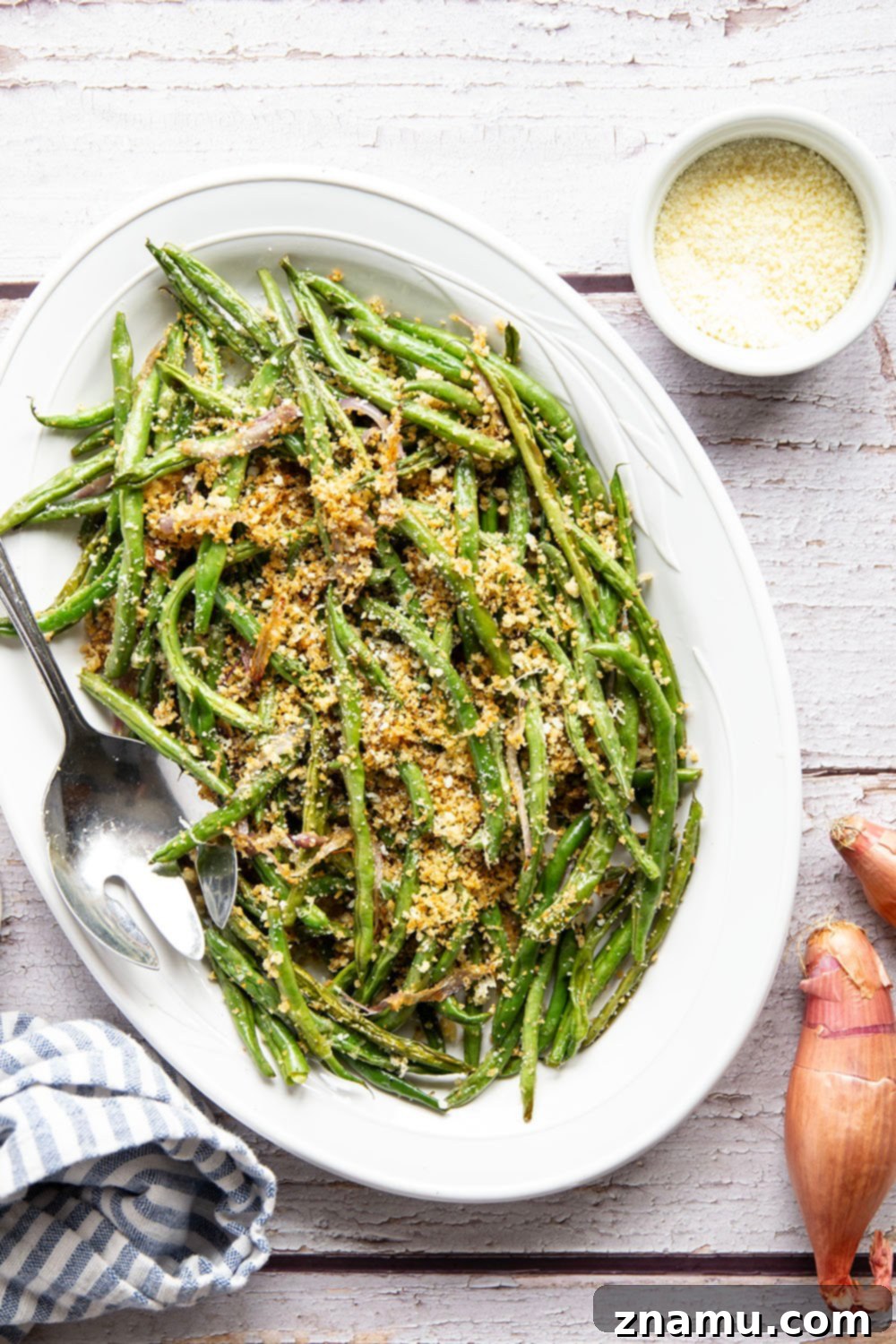 Golden Green Beans with Nutty Butter and Garlic Crunch 4 A serving of browned butter green beans with a focus on the tender green beans and golden breadcrumbs.