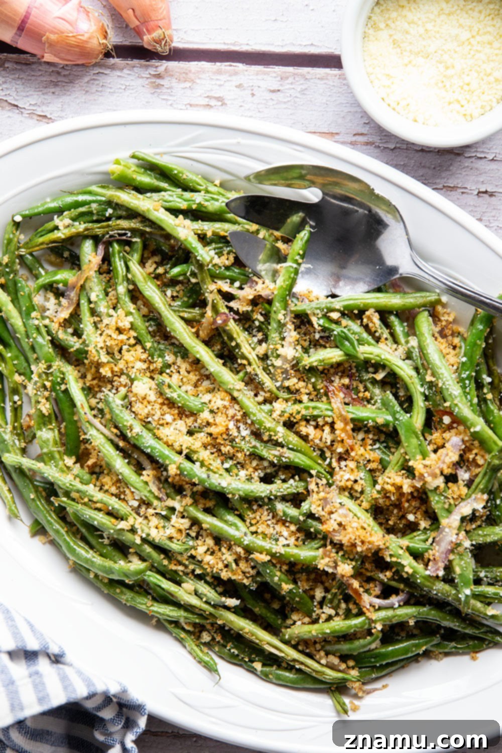 Golden Green Beans with Nutty Butter and Garlic Crunch 5 Fresh green beans and a shallot, ready for preparation.