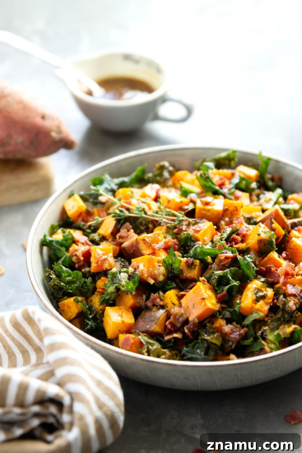 Hearty Sweet Potato Medley with Savory Bacon Infusion 3 Tender roasted sweet potatoes and fresh kale with savory bacon dressing