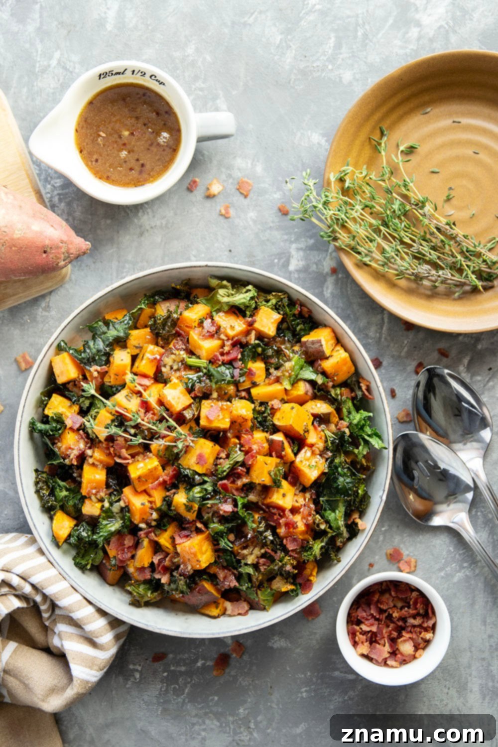 Hearty Sweet Potato Medley with Savory Bacon Infusion 4 Close-up of warm sweet potato salad with crispy bacon bits
