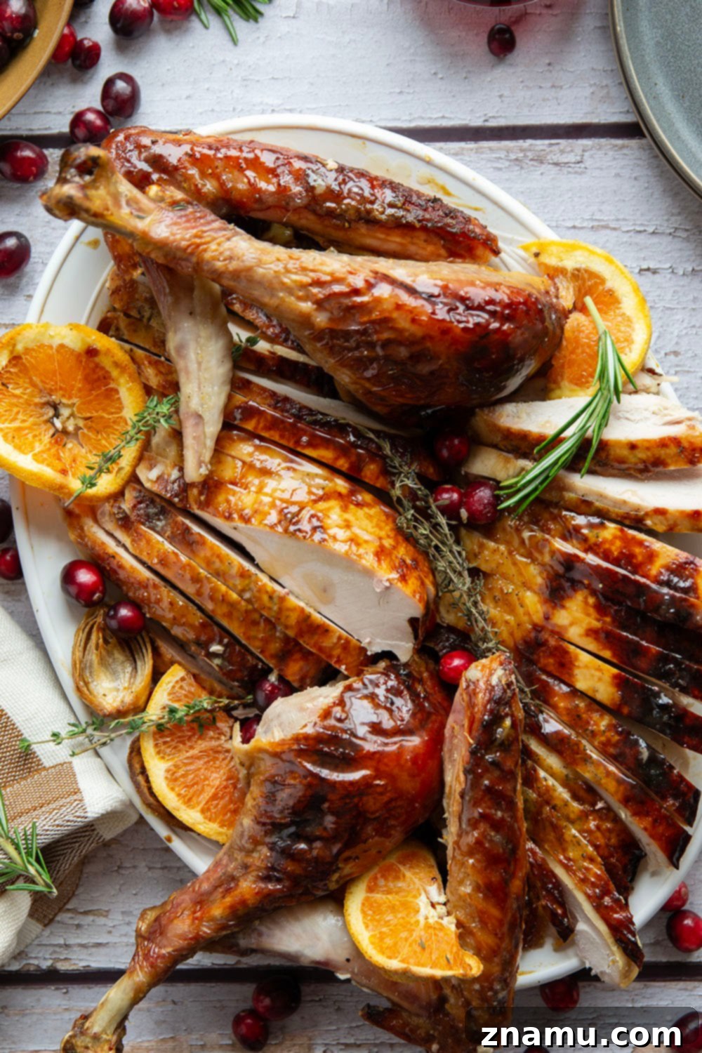 Golden Maple Turkey Roast 3 A close-up shot of the roasted Maple Glazed Turkey, highlighting its crispy, caramelized skin and the rich, golden hue from the maple syrup glaze. This simple recipe skips brining for an easier, yet incredibly juicy, Thanksgiving turkey.