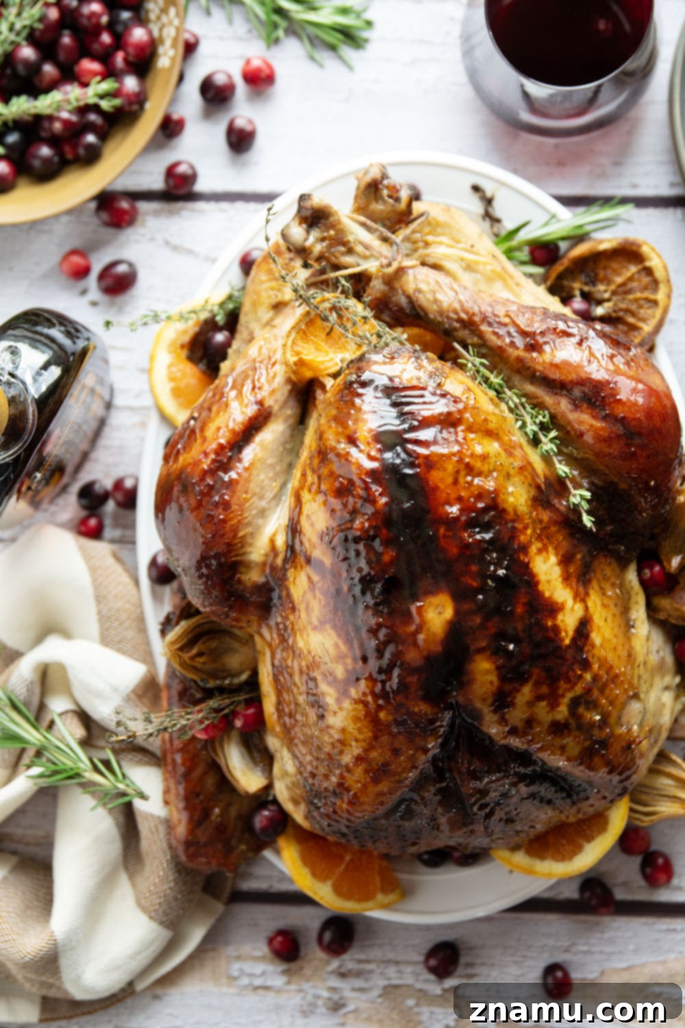 Golden Maple Turkey Roast 4 A close-up of the Maple Glazed Turkey, showing the beautifully golden skin with hints of the rich maple glaze. This image emphasizes the tempting texture and color of the roasted turkey, a perfect no-brine recipe for Thanksgiving.