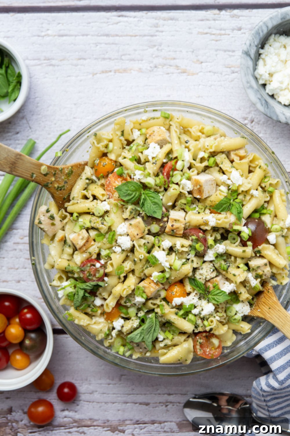 Vibrant Pesto Chicken Pasta Toss 2 Juicy grilled chicken and a flavorful pesto vinaigrette elevate this chicken pesto pasta salad. Perfect for cookouts, picnics, or a light lunch.