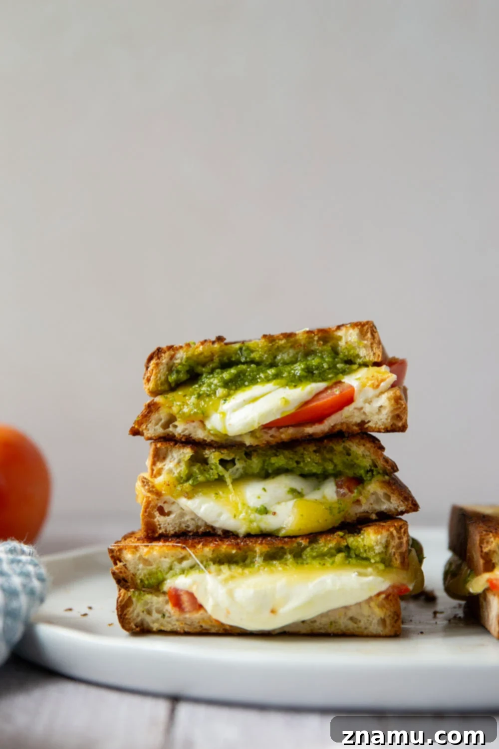 Gourmet Pesto Melt 4 Three different types of cheese melting inside a pesto grilled cheese sandwich