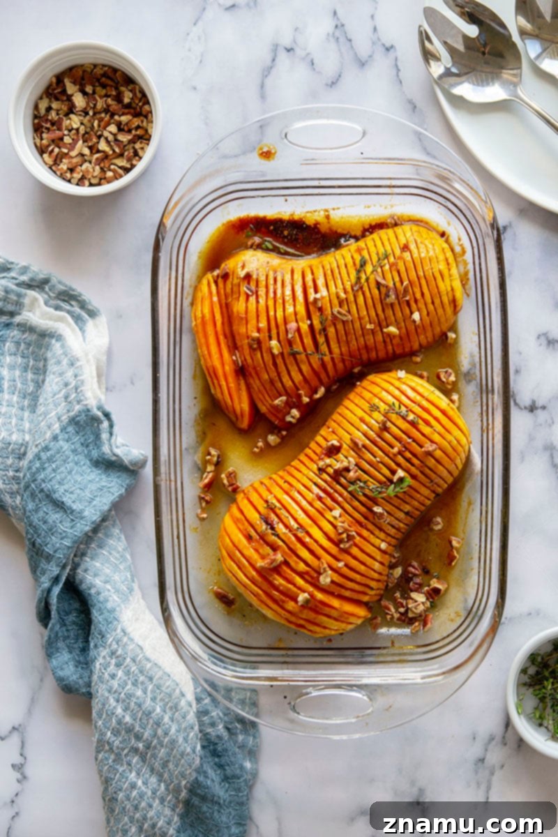 Your Thanksgiving Feast Roadmap 13 Hasselback Butternut Squash, fanned out and roasted to perfection, drizzled with maple browned butter sauce and garnished with fresh sage.