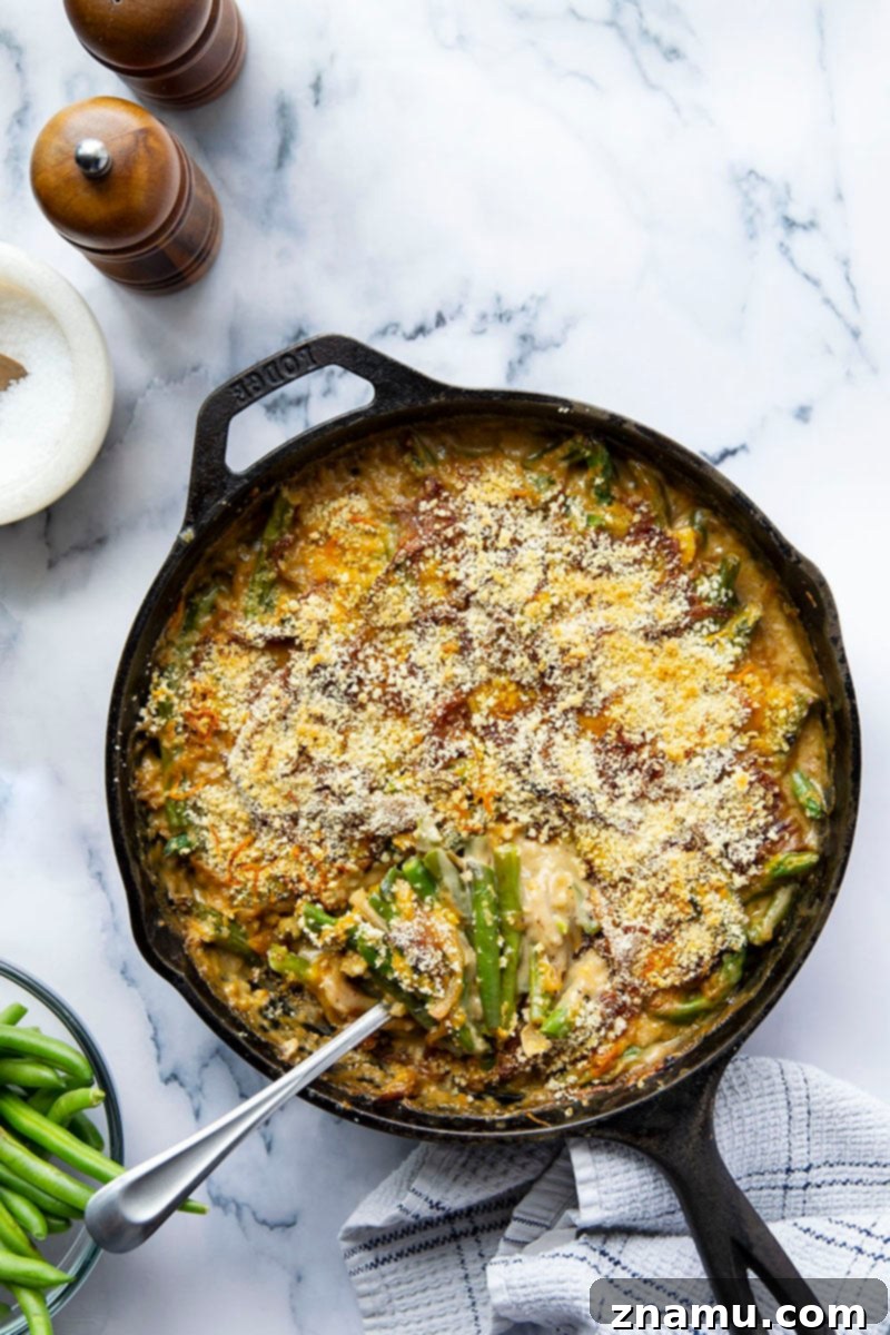 Your Thanksgiving Feast Roadmap 14 A bubbly Caramelized Onion Green Bean Casserole, topped with crispy breadcrumbs and fresh herbs, baked to golden perfection.