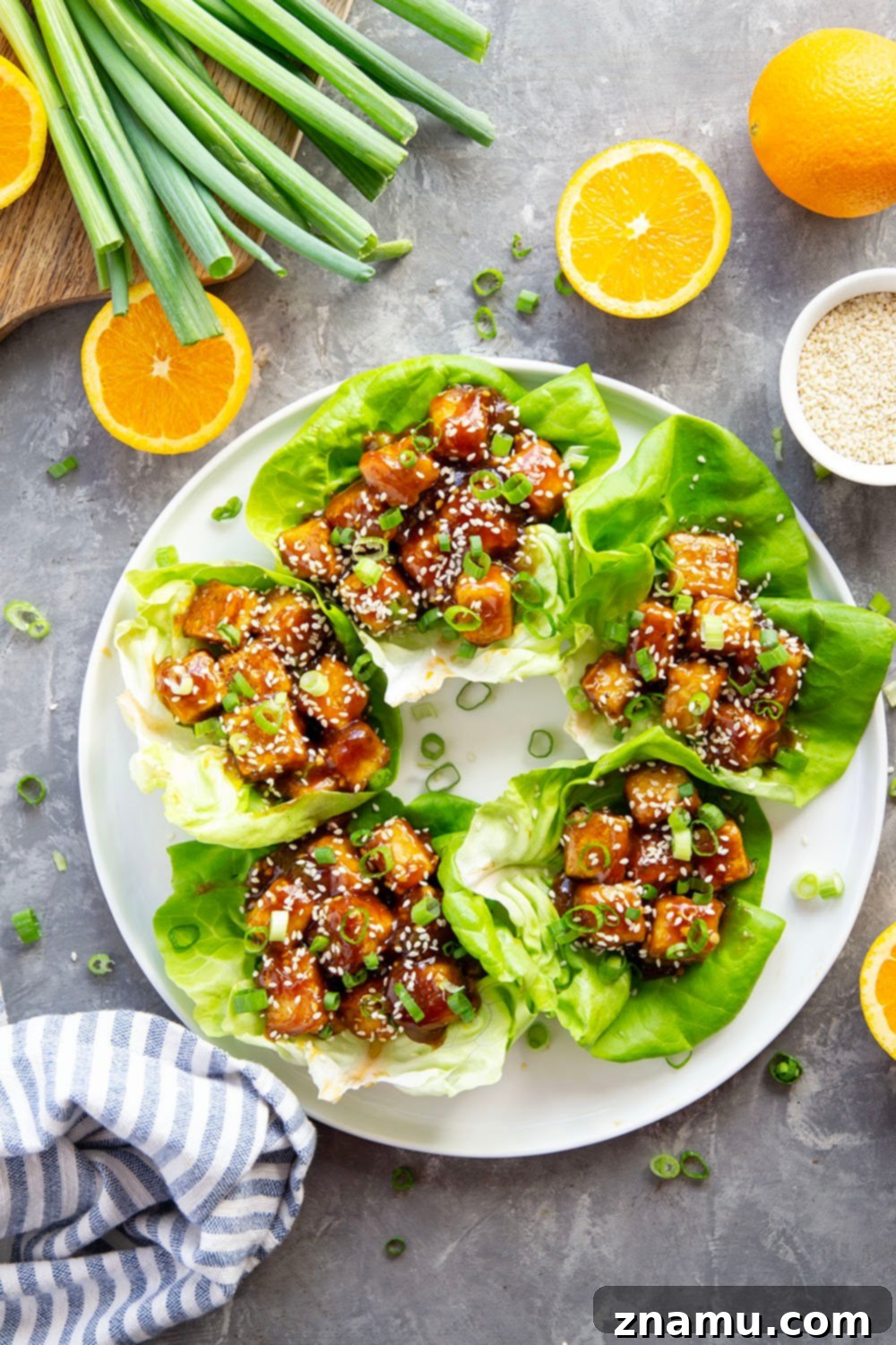 How to Press Tofu for the crispiest orange tofu lettuce wraps.