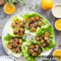 Orange Tofu Lettuce Wraps - a delicious vegan alternative to orange chicken.