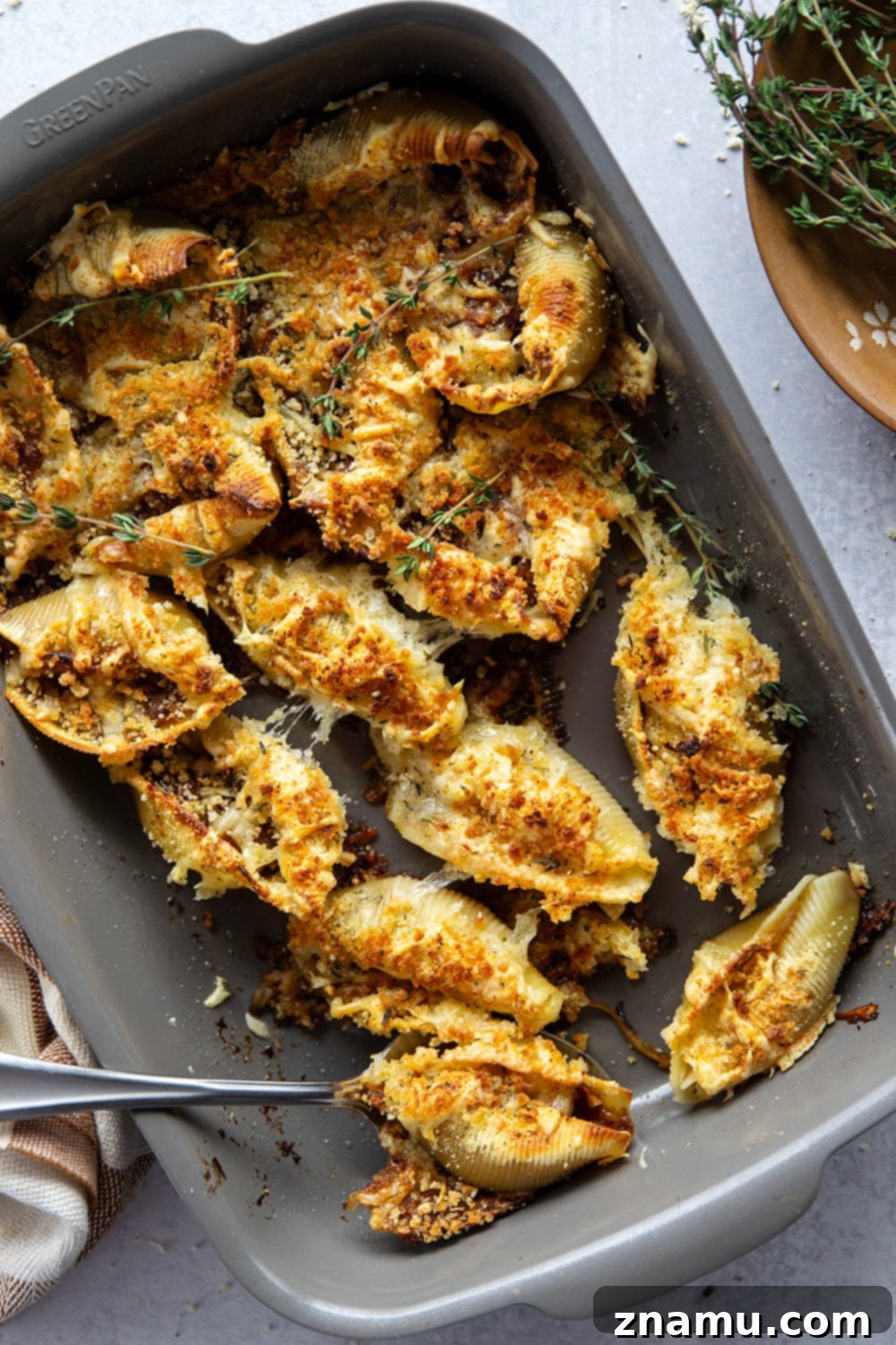 Caramelized Onion Gruyère Stuffed Shells 4 Close-up of French Onion Stuffed Shells, highlighting the cheesy topping and golden texture.