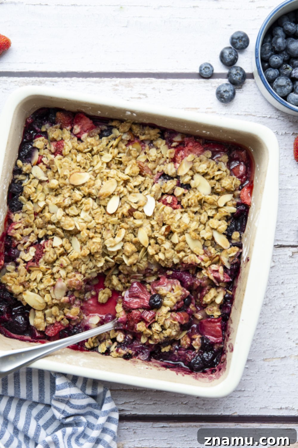Homestyle Rhubarb Berry Delight 5 Freshly diced rhubarb pieces, ready for baking in a delicious Rhubarb Berry Crisp, highlighting the texture and color of the ingredient.
