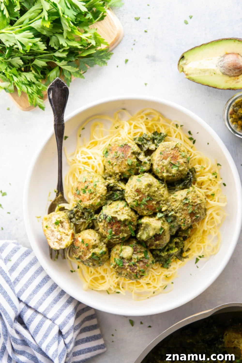 Creamy Green Goddess Chicken Meatballs 3 Homemade green goddess chicken meatballs served with creamy herb sauce.