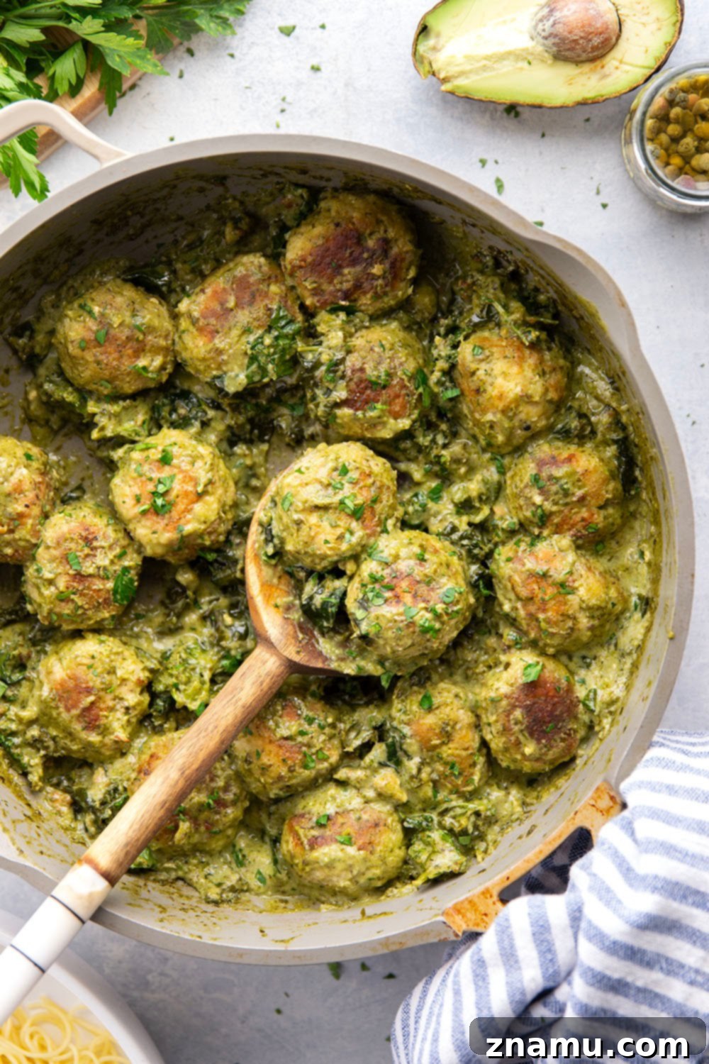 Creamy Green Goddess Chicken Meatballs 5 Green goddess chicken meatballs with a vibrant, creamy sauce.